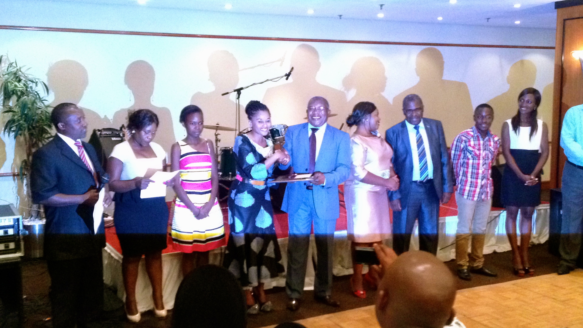 Sithembile Hlatshwayo receiving MISA and Save the Children award in Zambia